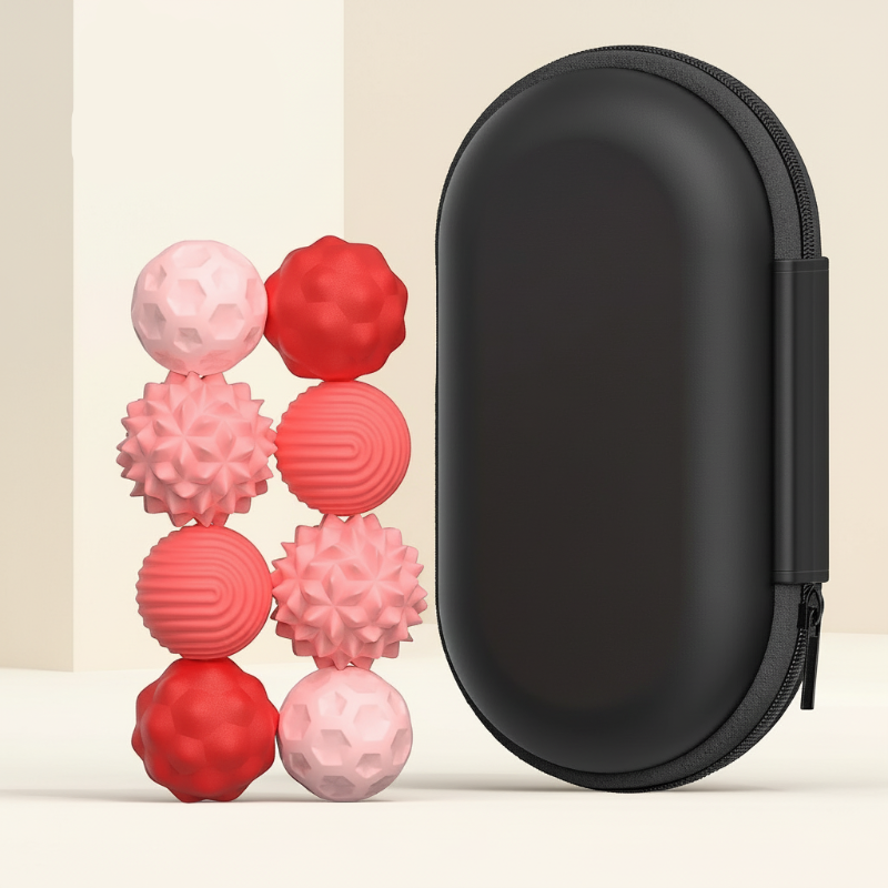 Eight small pink and red textured magnetic beads beside a tall black zippered case