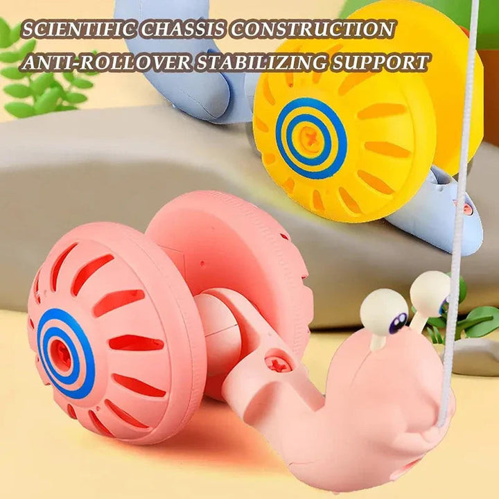 Pink snail pull toy with large shell-shaped wheels and a blue-and-yellow version behind it