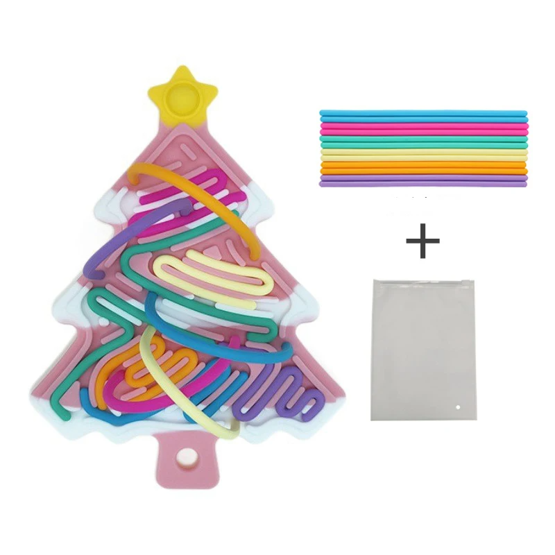 Pink snow-accented Christmas tree fidget with colorful cords and a storage bag