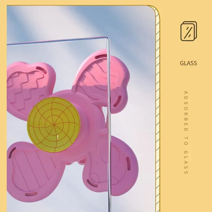 Pink animal spinner shown from the back with its suction cup attached to glass