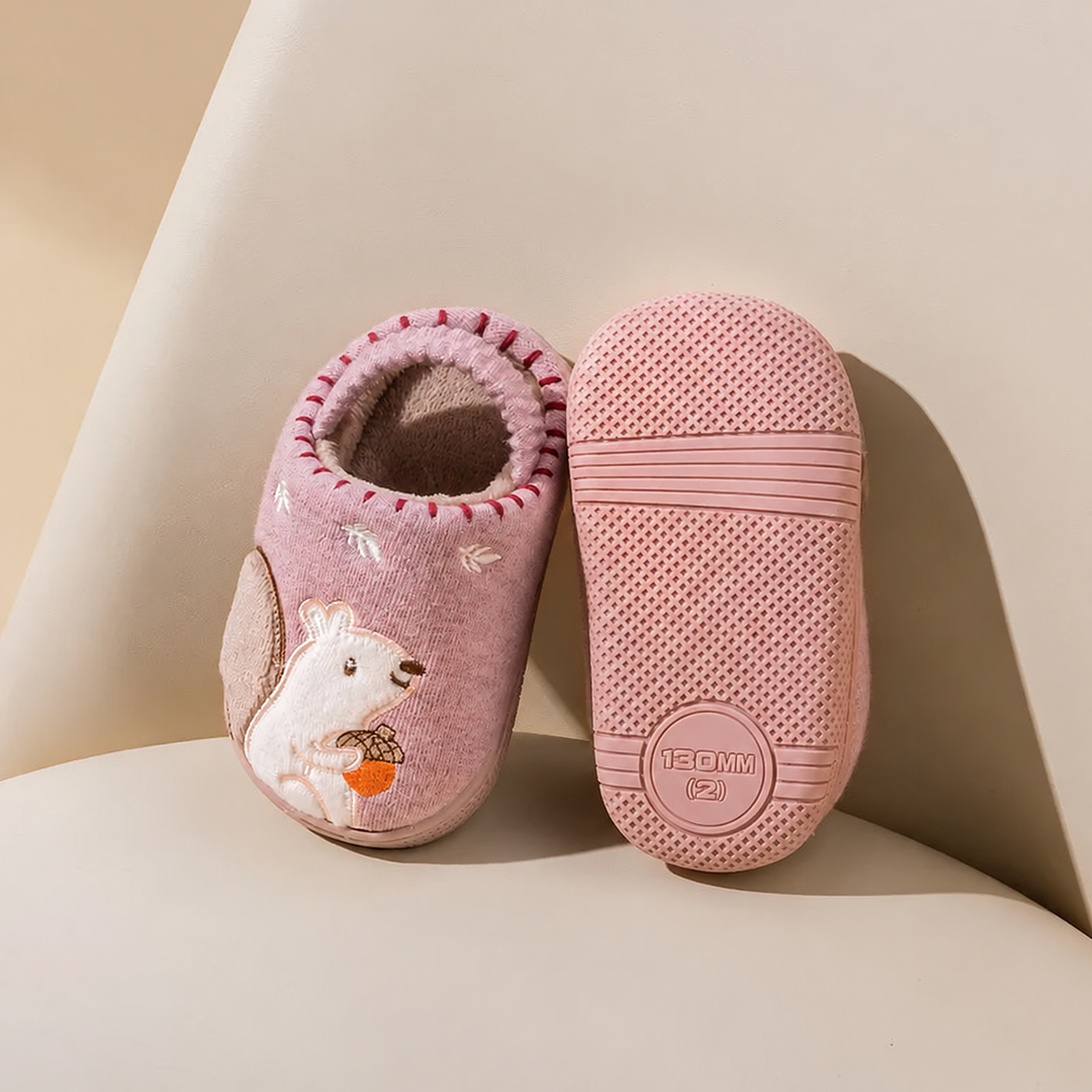 Pink squirrel slippers displayed with one upper and one textured sole facing forward