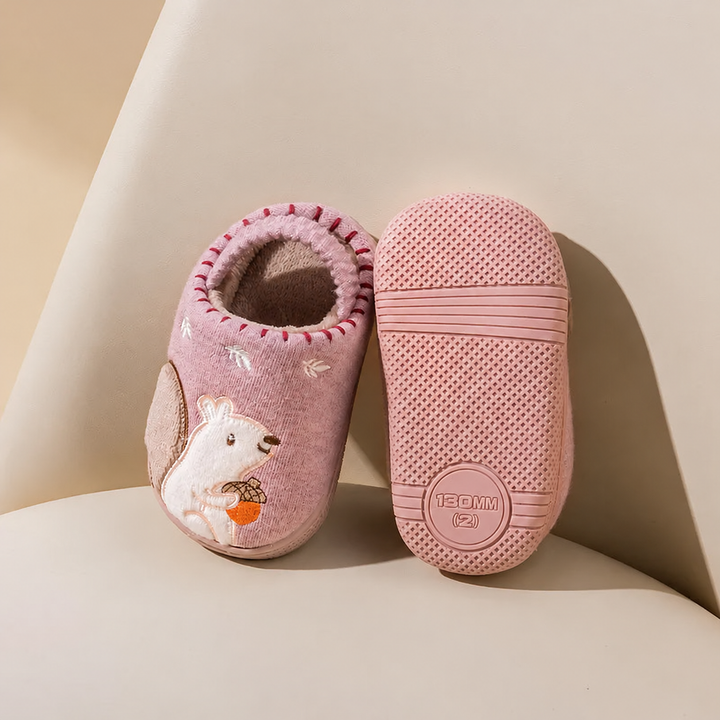 Pink squirrel slippers displayed with one upper and one textured sole facing forward