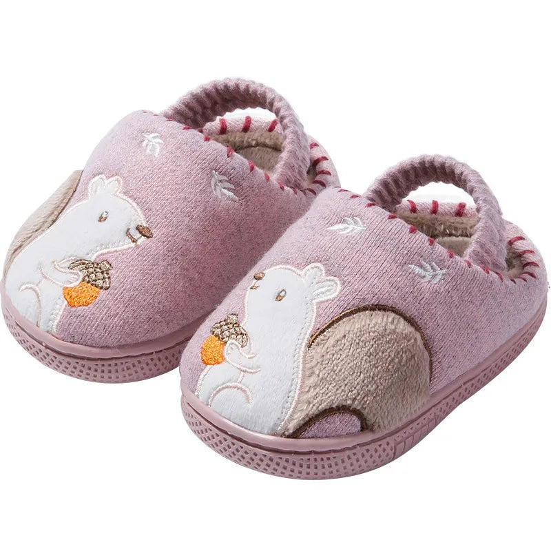 Pair of pink indoor slippers with squirrel appliques and plush lining