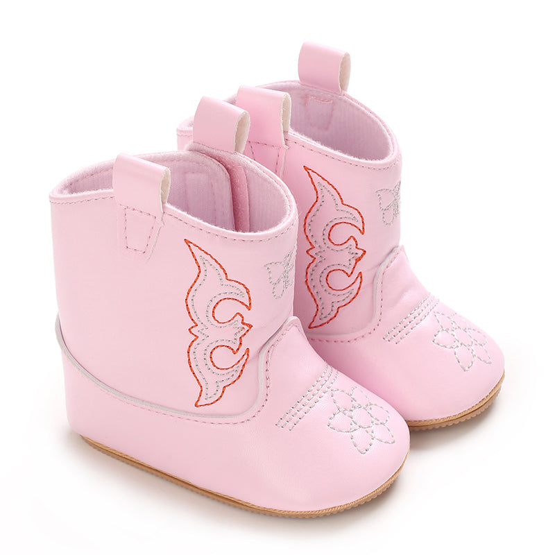 Pink baby cowboy boots with western stitching and pull tabs