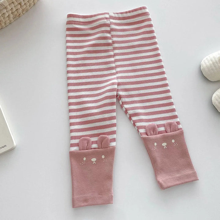 Pink-and-cream striped leggings with pink animal-face ankle cuffs