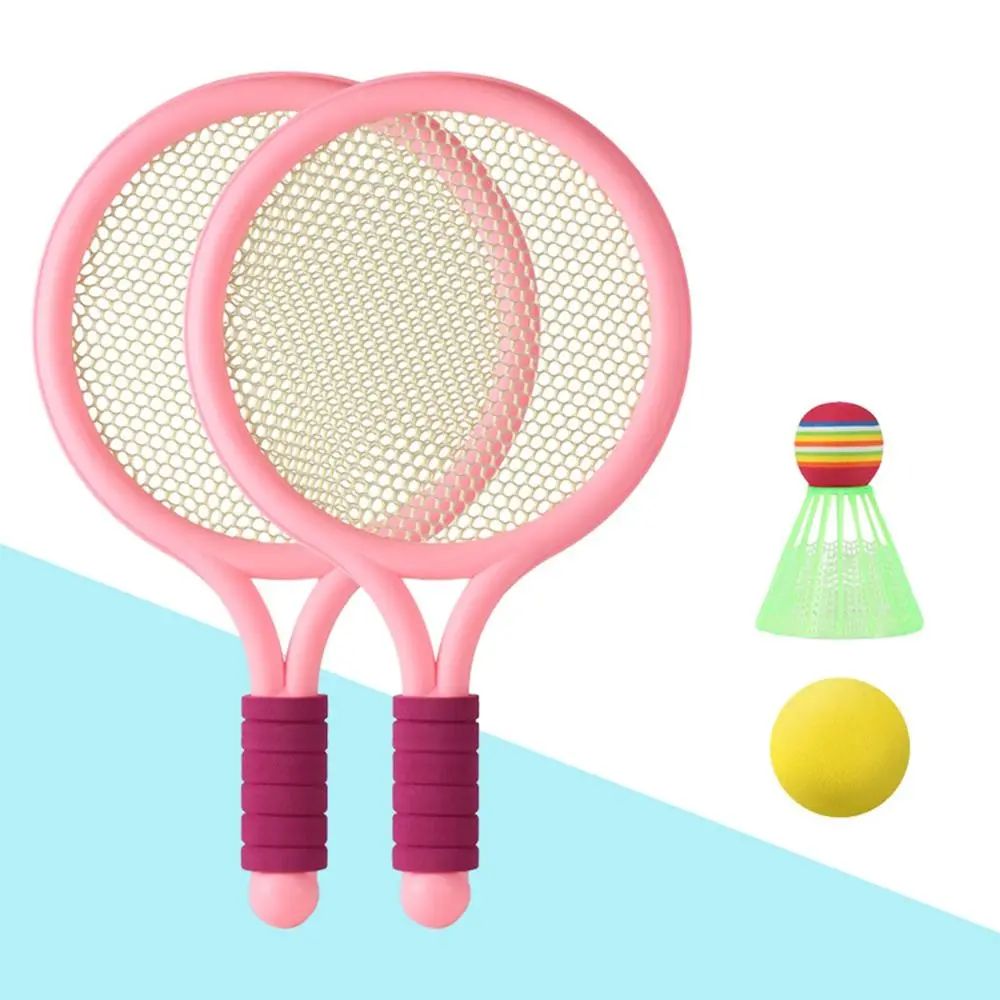 Two pink rackets with dark pink grips, a yellow ball and green shuttlecock