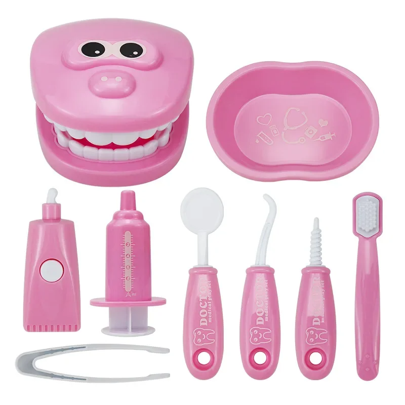 Pink tooth model with a matching tray, toothbrush, mirror, tweezers, and pretend dental tools