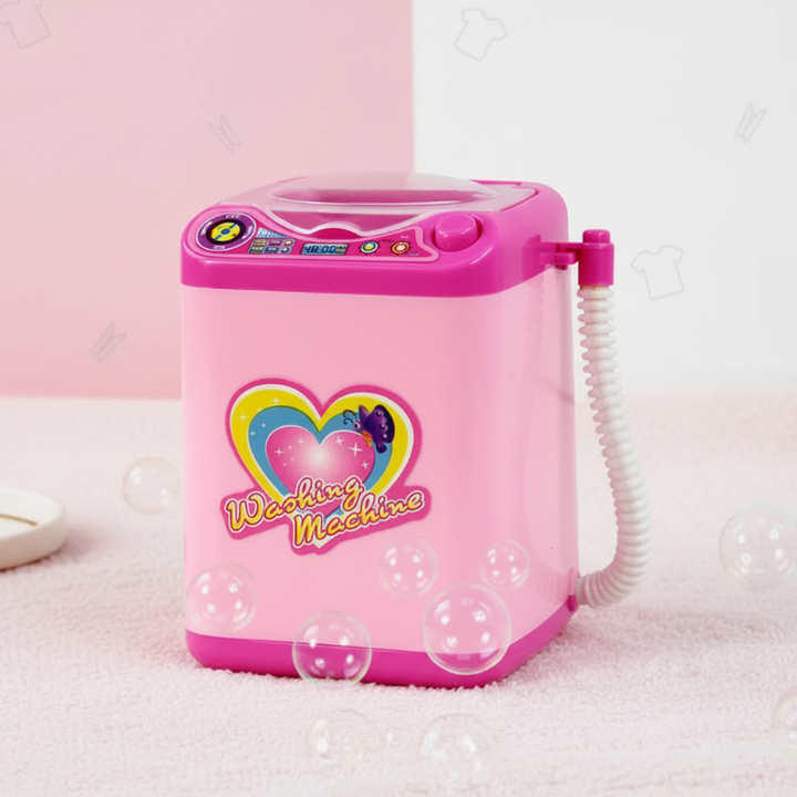 Pink top-loading toy washing machine with a side hose