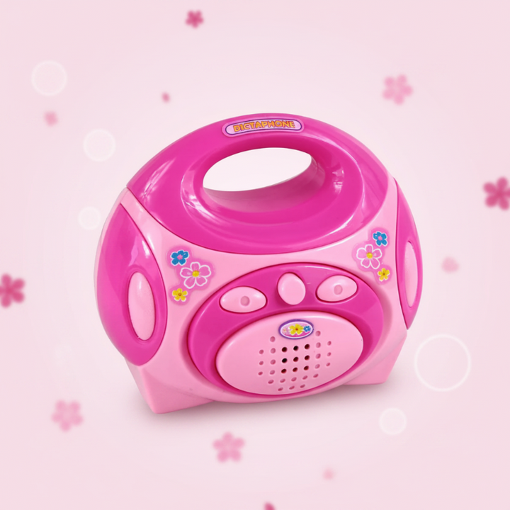 Pink toy radio with a carry handle, front buttons, and speaker grille