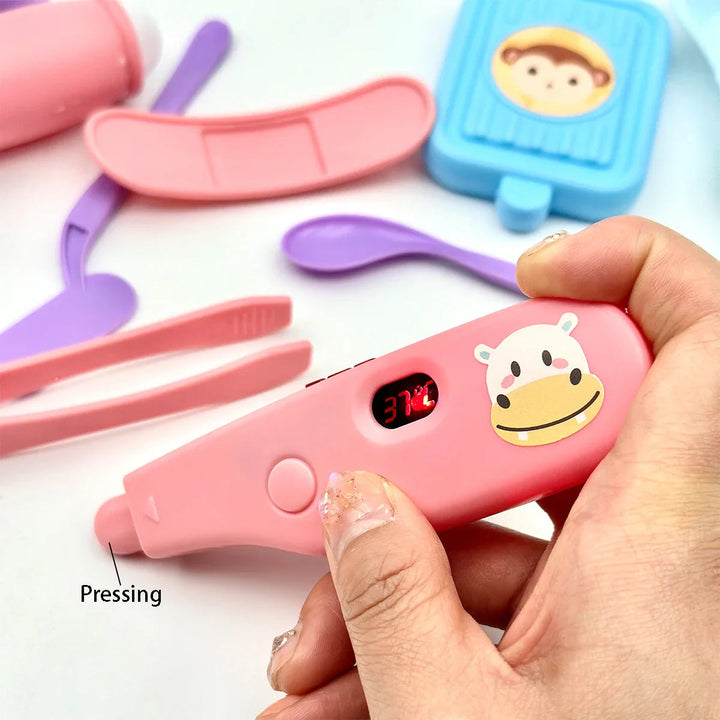 Hand pressing a pink toy thermometer with an illuminated red number display