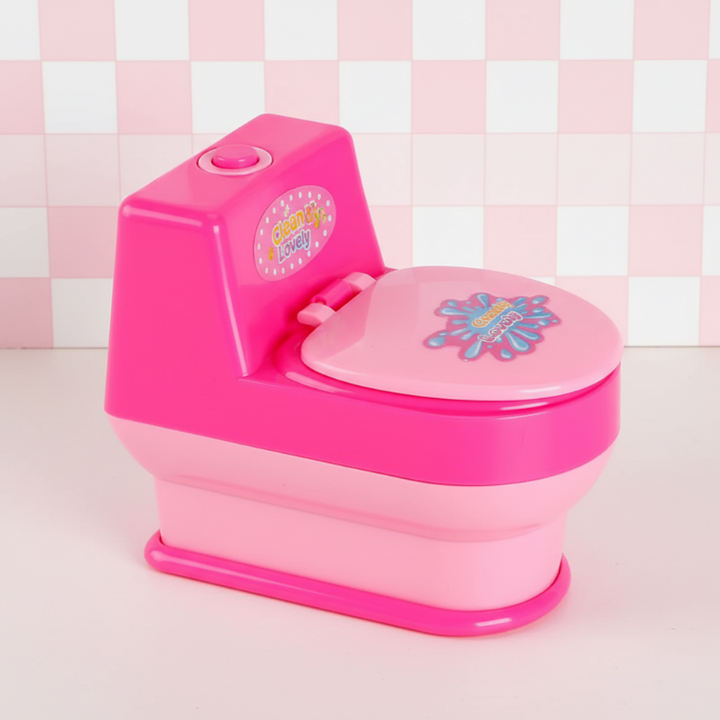 Pink toy toilet with a closed lid and button on the tank