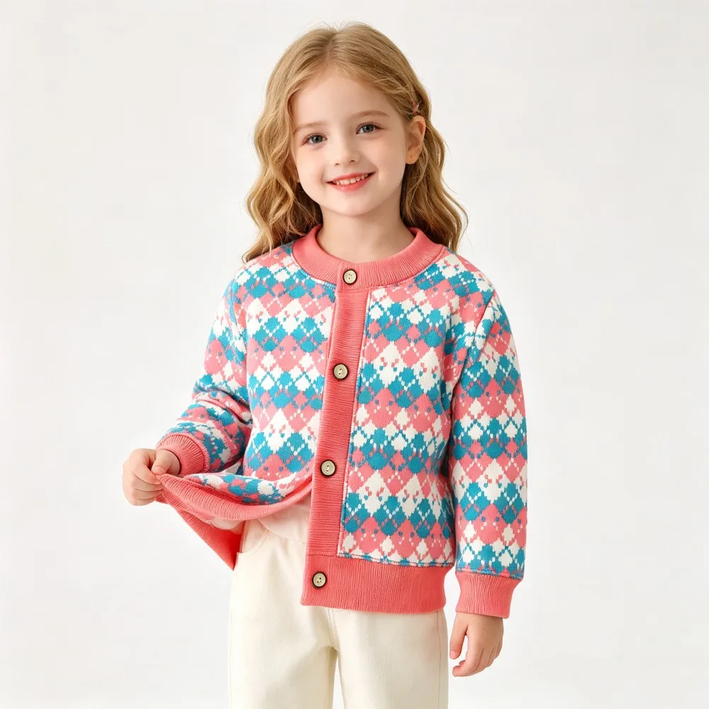 Child wearing a pink, turquoise, and white diamond-pattern knit cardigan