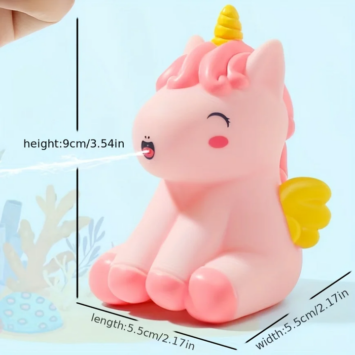 Pink unicorn bath toy with a yellow horn and wings, shown with dimensions