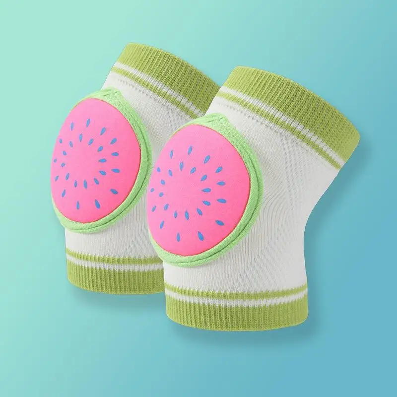 Pair of pink watermelon knee pads with green trim and white knit sleeves.