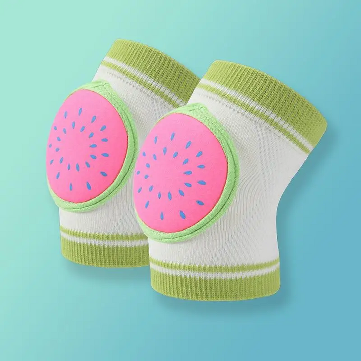Pair of pink watermelon knee pads with green trim and white knit sleeves.