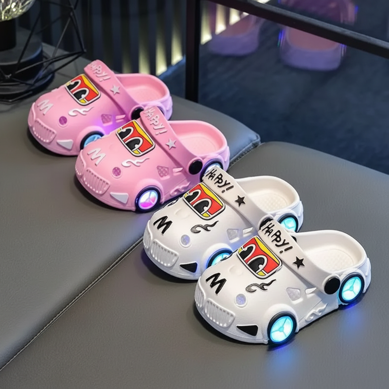 Pink and white car slipper pairs with illuminated wheel details and heel straps.
