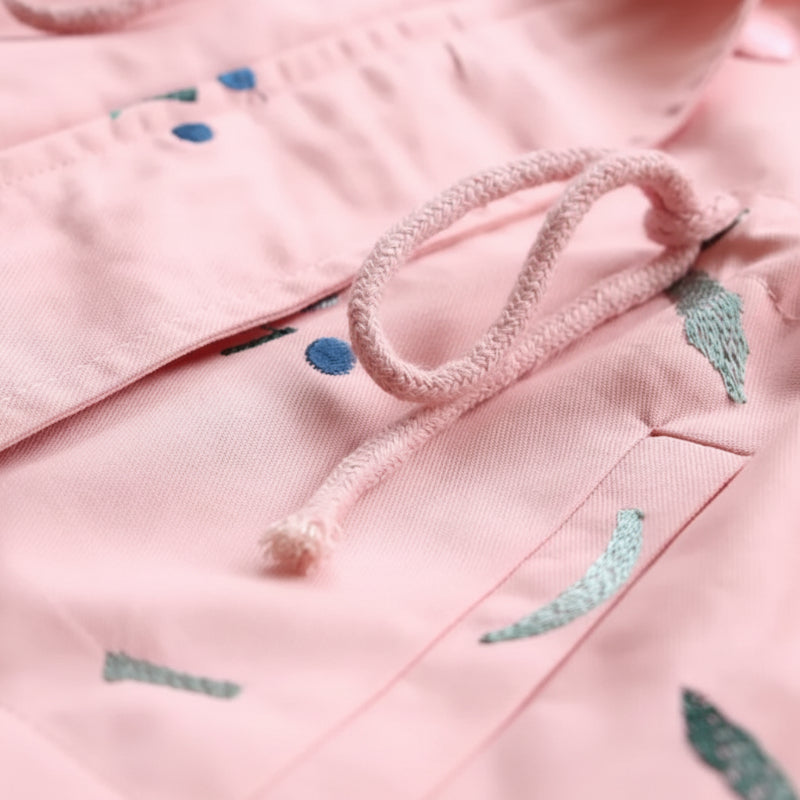 Pink windbreaker drawstring waist and pocket flap detail