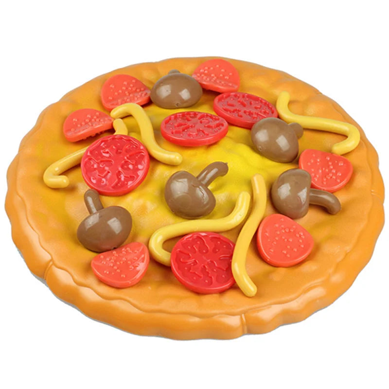 Overhead view of the pizza tray with red, yellow, and brown toy toppings