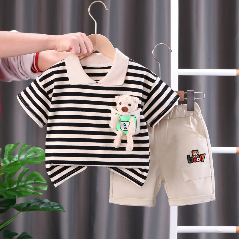 Black-and-cream striped short-sleeve T-shirt with a bear accent and beige shorts