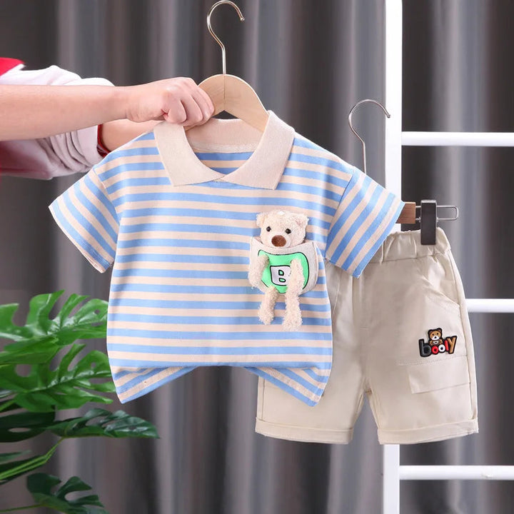 Blue-and-cream striped collared T-shirt with a plush bear detail and beige shorts