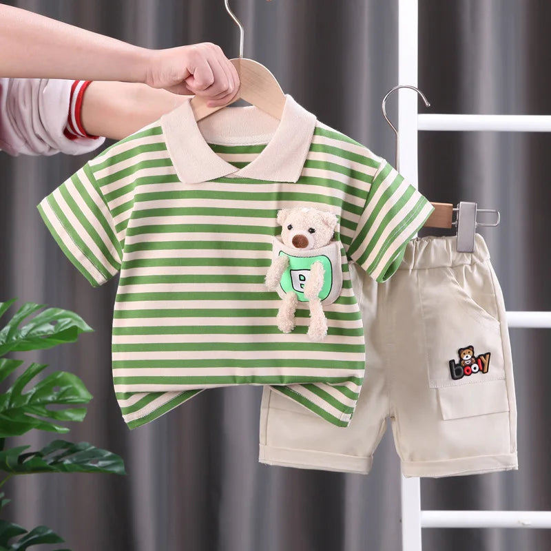 Green-and-cream striped collared T-shirt with a plush bear detail and beige shorts