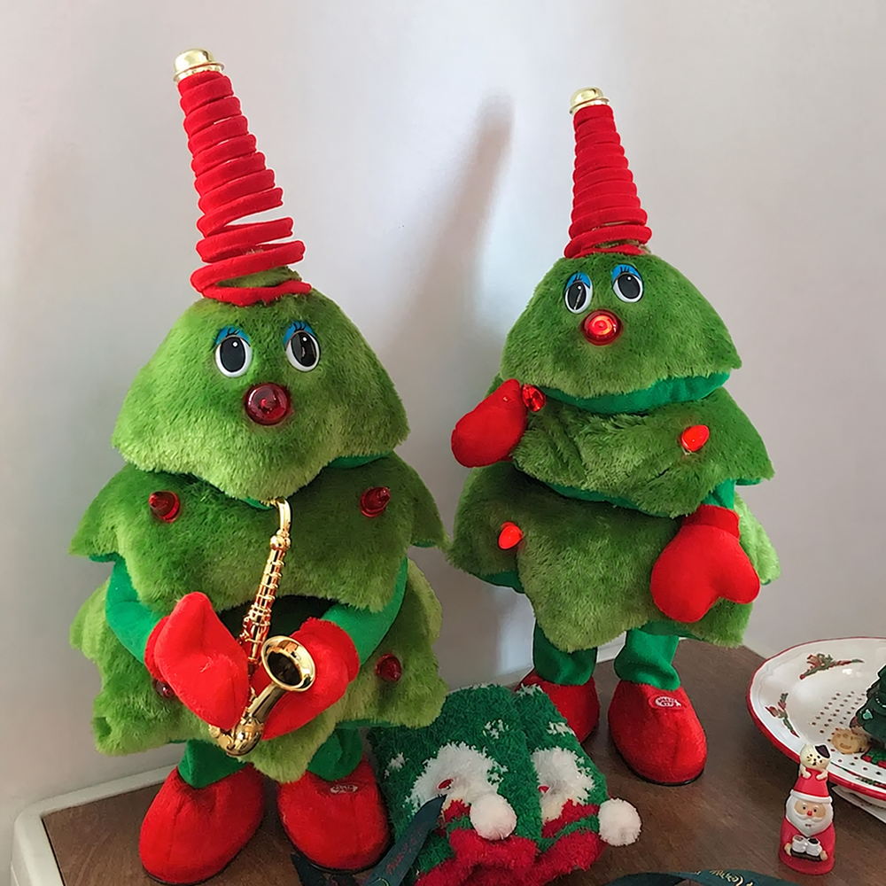 Saxophone and classic plush Christmas tree toys displayed side by side on a table.