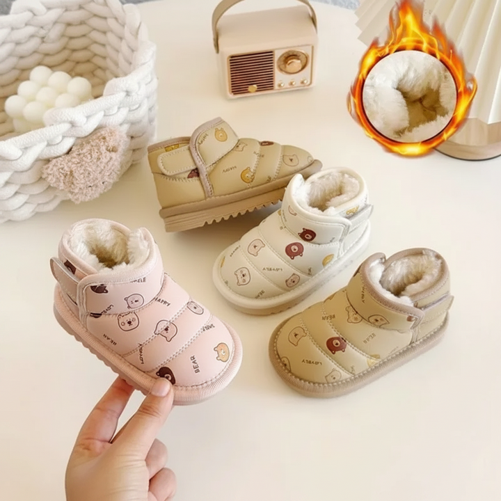 Pink animal-print boot held beside beige and brown boots, with an inset showing the plush lining