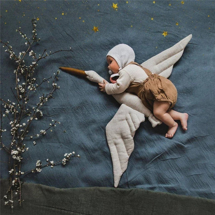Baby portrait with a plush swan&