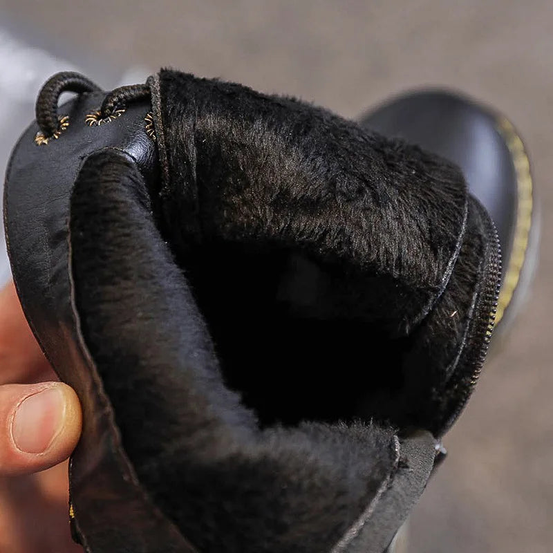 Close-up of the plush black synthetic lining inside a lace-up boot