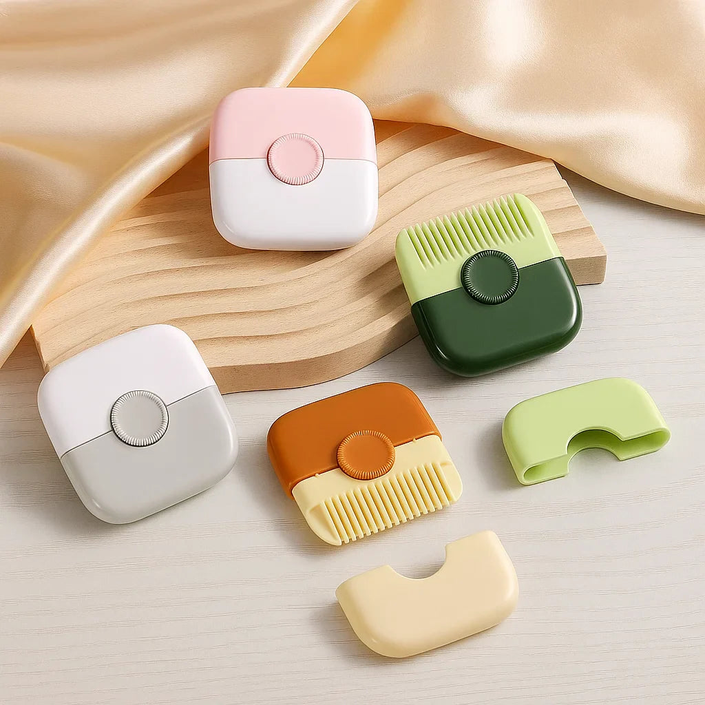 Compact hair trimmers in pink, gray, orange, and green with removable covers on a tabletop