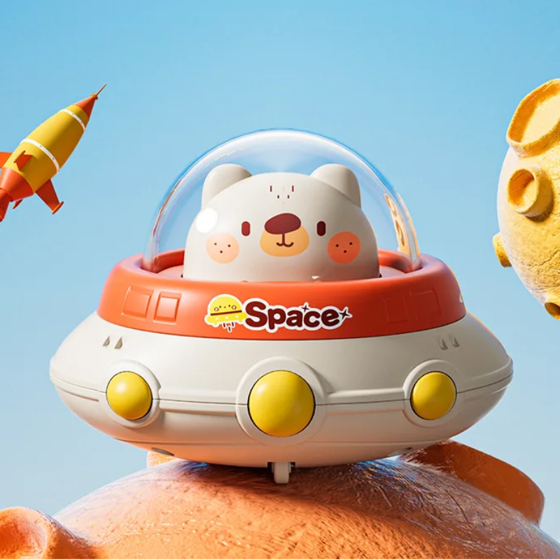 Polar bear UFO toy with an orange-red rim, white base, and yellow round details.