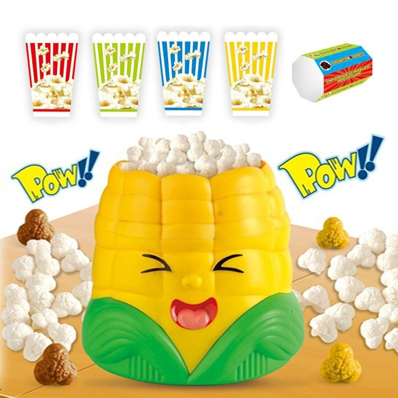 Corn-shaped popcorn game with four striped cups, toy popcorn pieces and a die