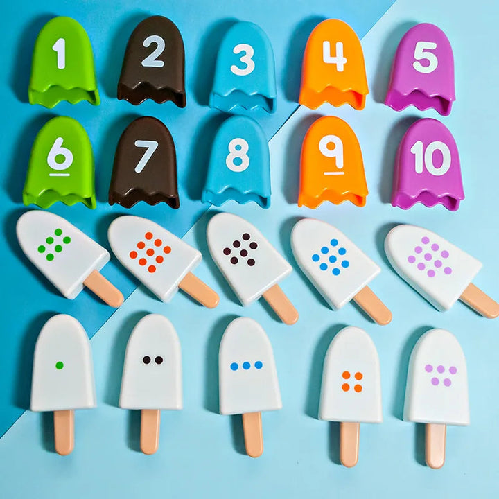 Numbered popsicle covers lined up above matching dotted counting pieces