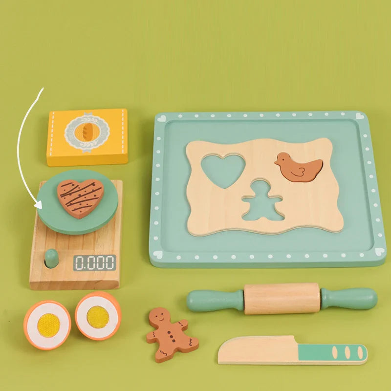 Overhead view of a wooden baking set with a heart cookie on the play scale and shapes in the dough board