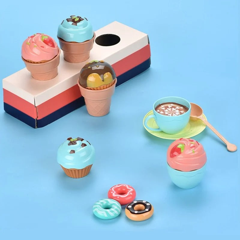 Toy ice cream cones, cupcakes and small pastries beside a cup and saucer