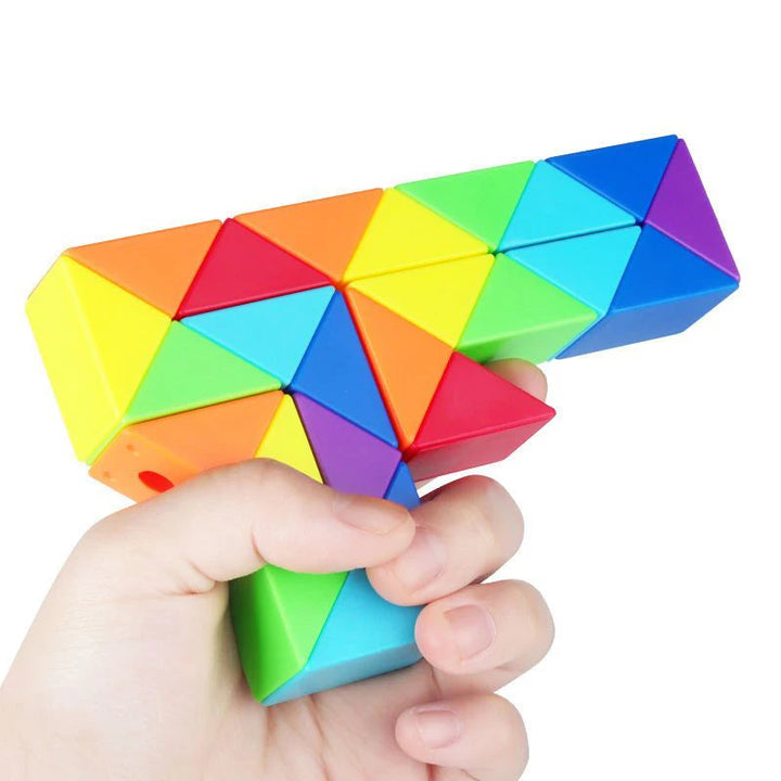 Hand holding a multicolor snake puzzle folded into an angular design.