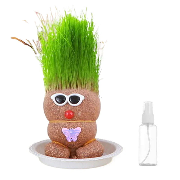 Punk-style grass figure with white sunglasses in a white bowl beside its included spray bottle