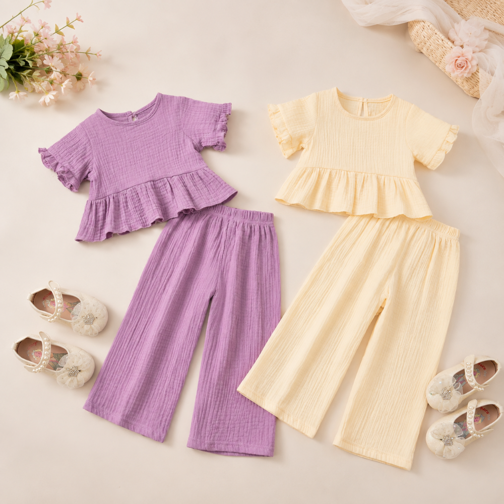 Purple and beige girls' outfit sets with ruffle tops and matching wide-leg pants laid side by side