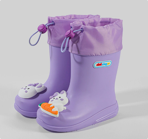 Purple rain boots with bunny and carrot decorations and drawstring cuffs
