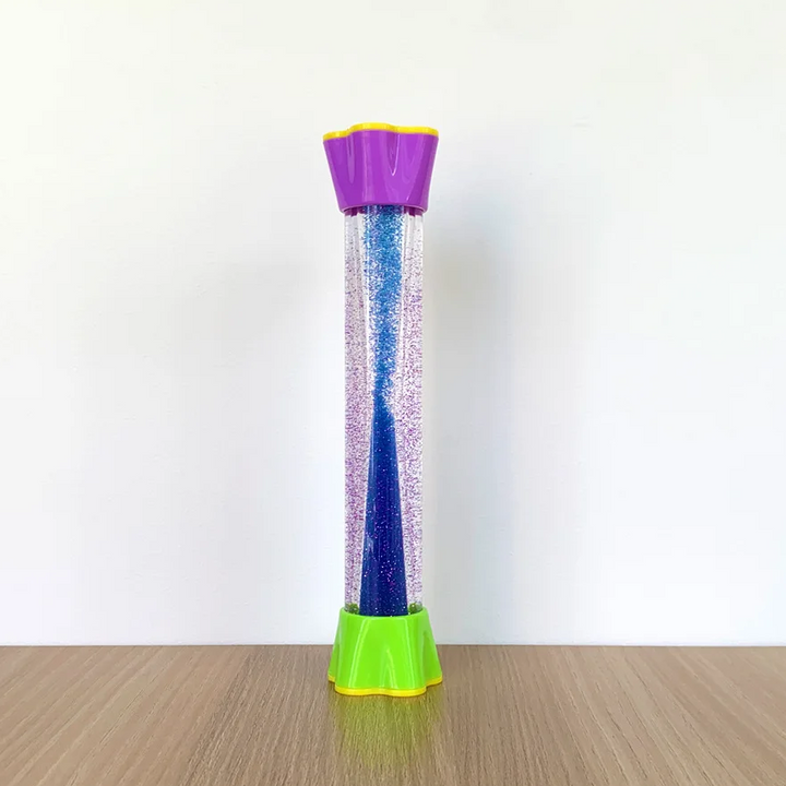 Blue glitter sensory tube with a purple top and green base