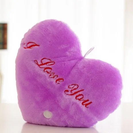 Purple heart-shaped plush pillow with red I Love You embroidery