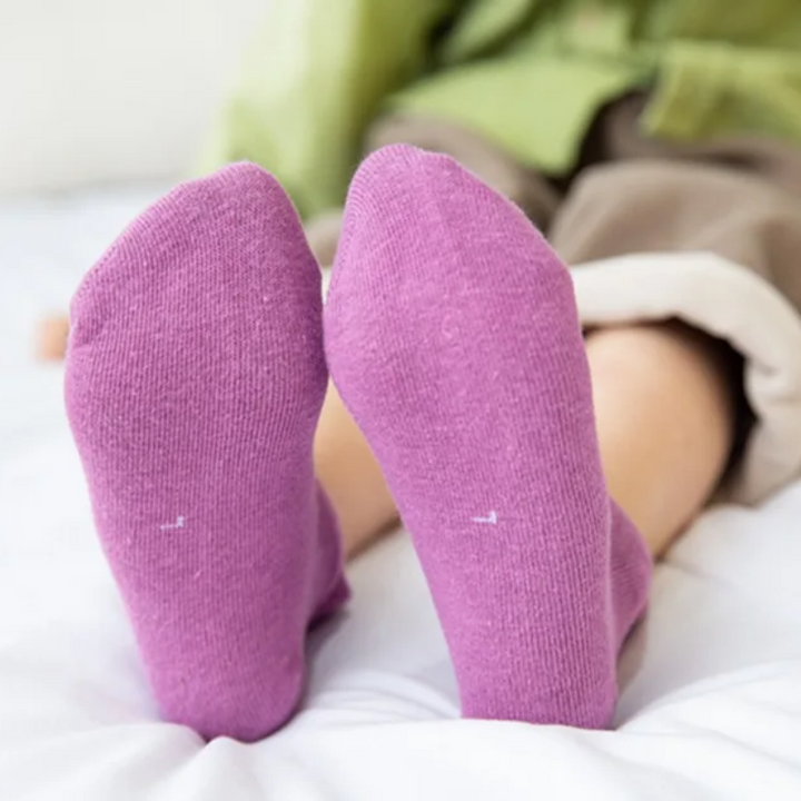 Purple sock soles shown on a child&