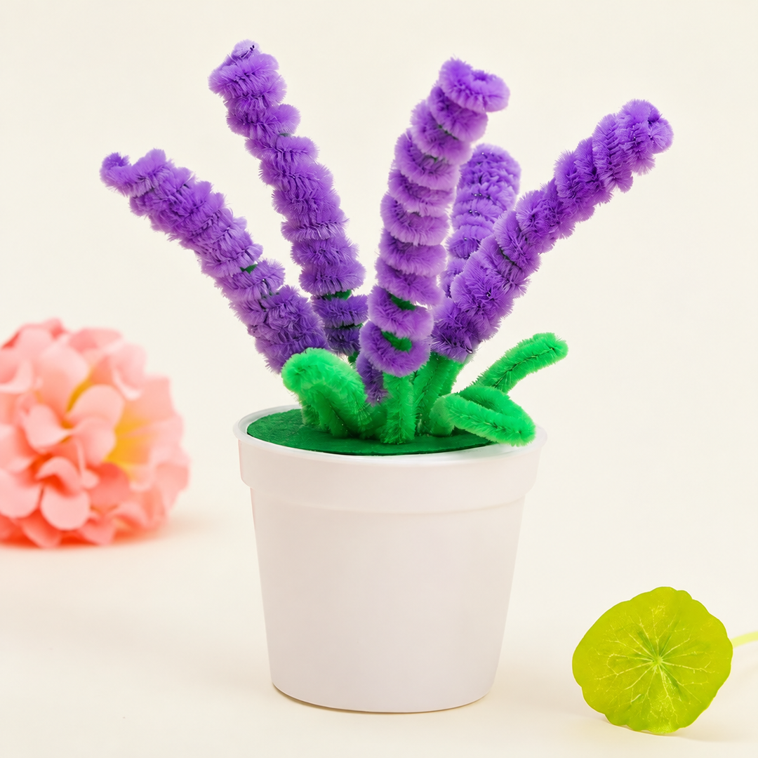 Purple fuzzy-wire lavender stems with green leaves in a white pot