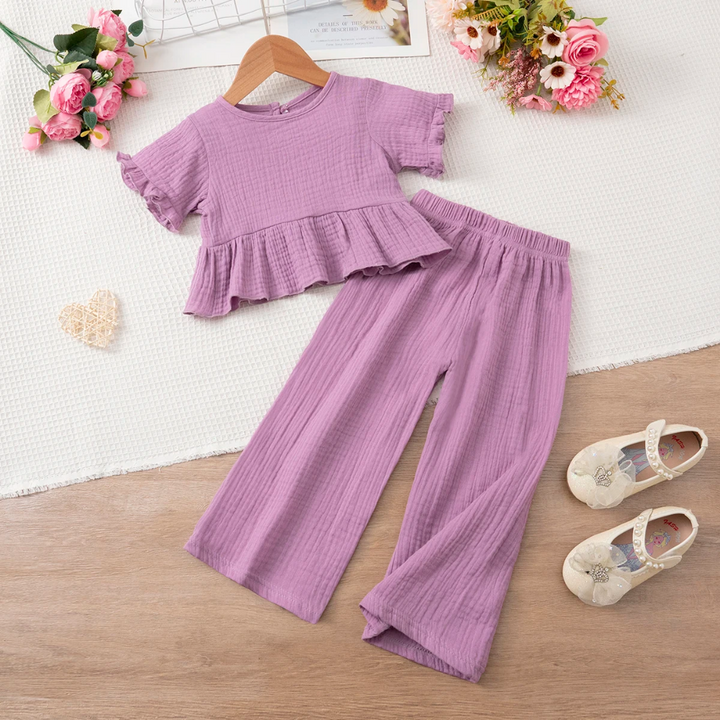 Front view of the purple ruffle top and matching wide-leg pants laid flat