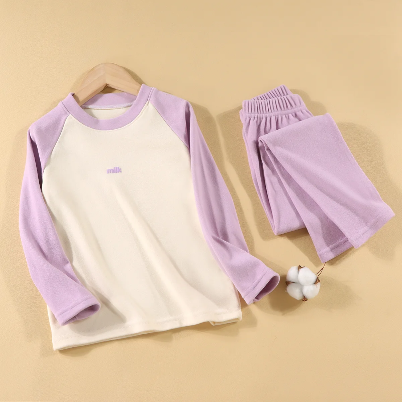 Purple pajama set with a cream-front raglan top and matching elastic-waist pants.