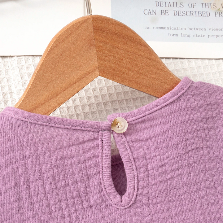 Back button and keyhole opening on the purple cotton top