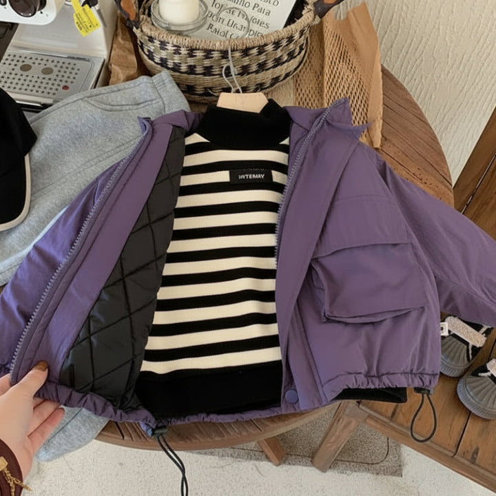 Open purple windbreaker showing quilted interior lining and a striped top