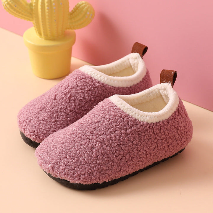 Purple wool slippers with cream-colored lining and brown heel pull tabs