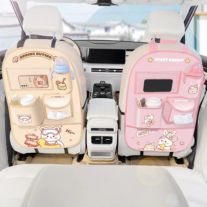 Beige bear and pink rabbit organizers attached to the backs of two front seats