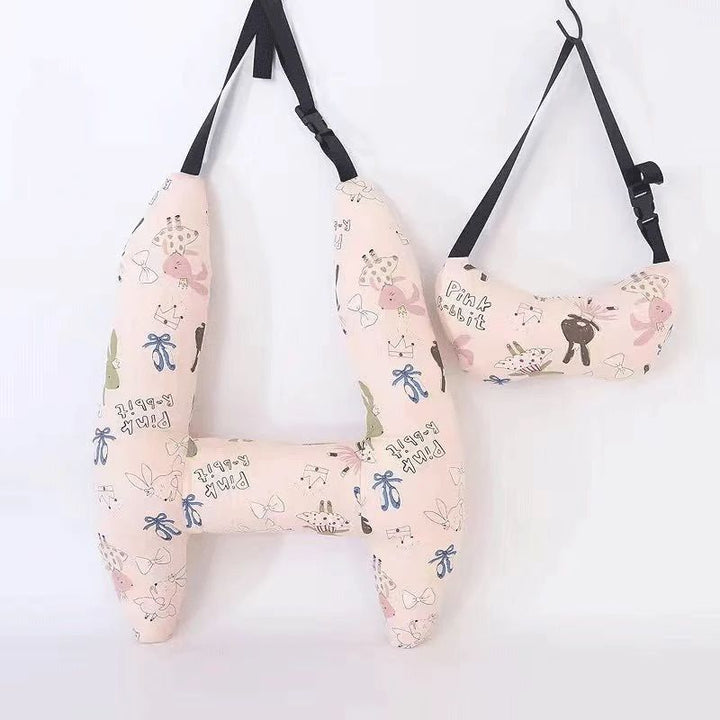 Front view of the pink rabbit-print H-shaped car pillow and matching neck pillow